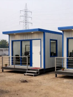Rows of portable accommodation cabins at a desert labour camp